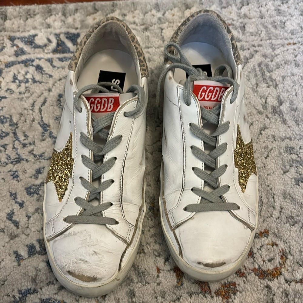 Golden Goose animal print sneaker with glitter gold star. Excellent condition